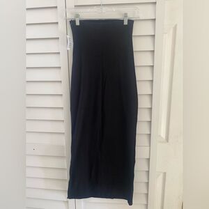 Black strapless dress with side slit.